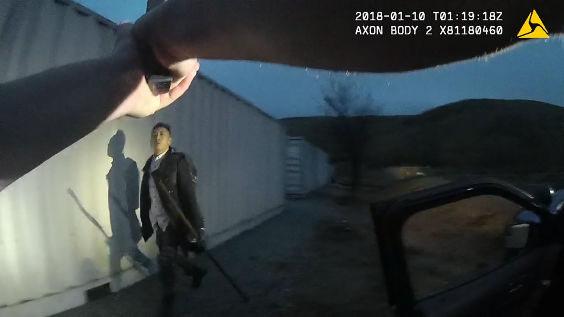 In this still from an officer’s body camera video, Thompson Nguyen walks through a South San Jose power plant, carrying a metal pipe and an ax and yelling, “Shoot me.”