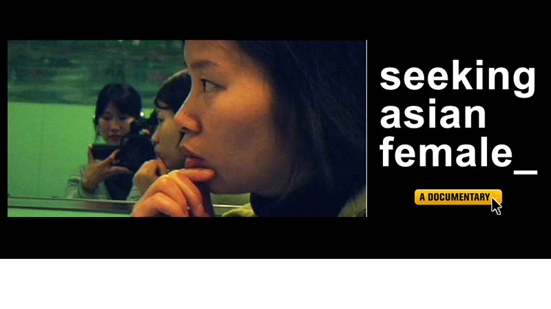A reflective photo of a woman rests her chin on her hand, gazing thoughtfully. Another woman is seen in the background with a camera. The text reads "Seeking Asian Female by Debbie Lum" accompanied by the yellow "Unity Film Series" label with a cursor pointing to it.