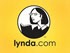 The image shows the logo for lynda.com, an online learning platform. The logo features an illustration of a woman with glasses and short hair, drawn in black and white, inside a circular emblem with a yellow background. Below the emblem, "lynda.com" is written. Whether you're into iPhone photography or storytelling, this platform offers myriad courses to enhance your skills.