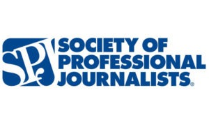 The image features the logo of the Society of Professional Journalists. The acronym "SPJ" is stylized in white against a blue background on the left. To the right, the organization's name, "Society of Professional Journalists," is written in bold blue letters, celebrating its SPJ awards and notable alumni.