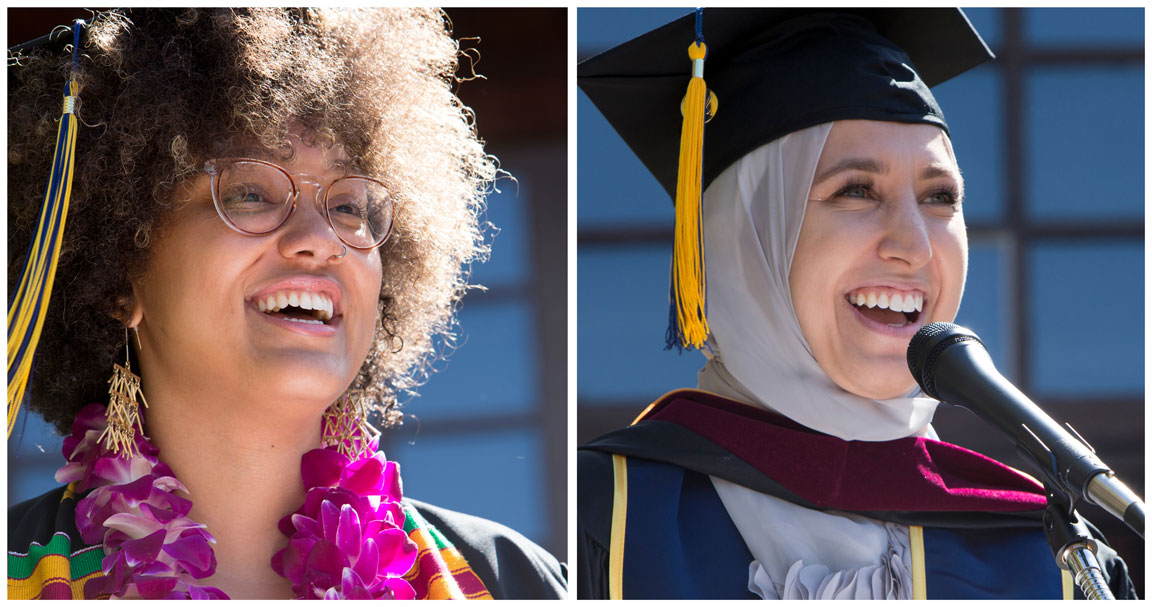 Side-by-side images of two graduates at a Berkeley Journalism ceremony. The left graduate has curly hair, wears glasses, a colorful sash, and a flower lei. The right graduate wears a hijab, cap, gown, and tassel, speaking into a microphone. Both are smiling brightly.