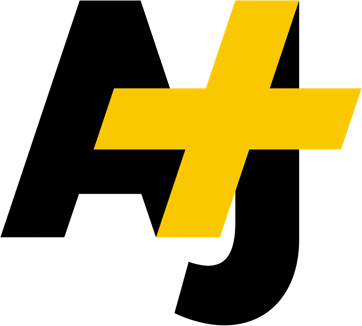 A black "AJ" logo with a large, yellow plus sign partially covering the right side of the "A". The design is simple and modern, exuding a bold and professional look reminiscent of Berkeley Journalism. The background of the image is transparent.