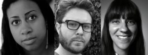 A black-and-white image featuring three people. On the left, a person with dark hair and an attentive expression. In the center, a person with glasses and a beard, possibly discussing Berkeley Journalism. On the right, a person with straight hair and bangs, smiling warmly.
