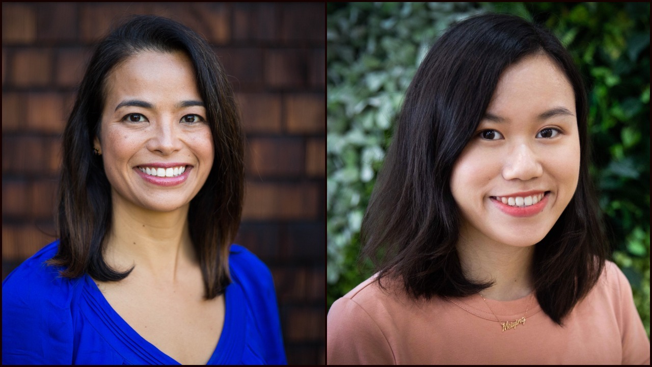 Two women, both with medium-length dark hair, are smiling at the camera. The woman on the left, wearing a blue top, stands against a brick background. The woman on the right wears a peach top and is in front of foliage, embodying the vibrant spirit of Berkeley Journalism.