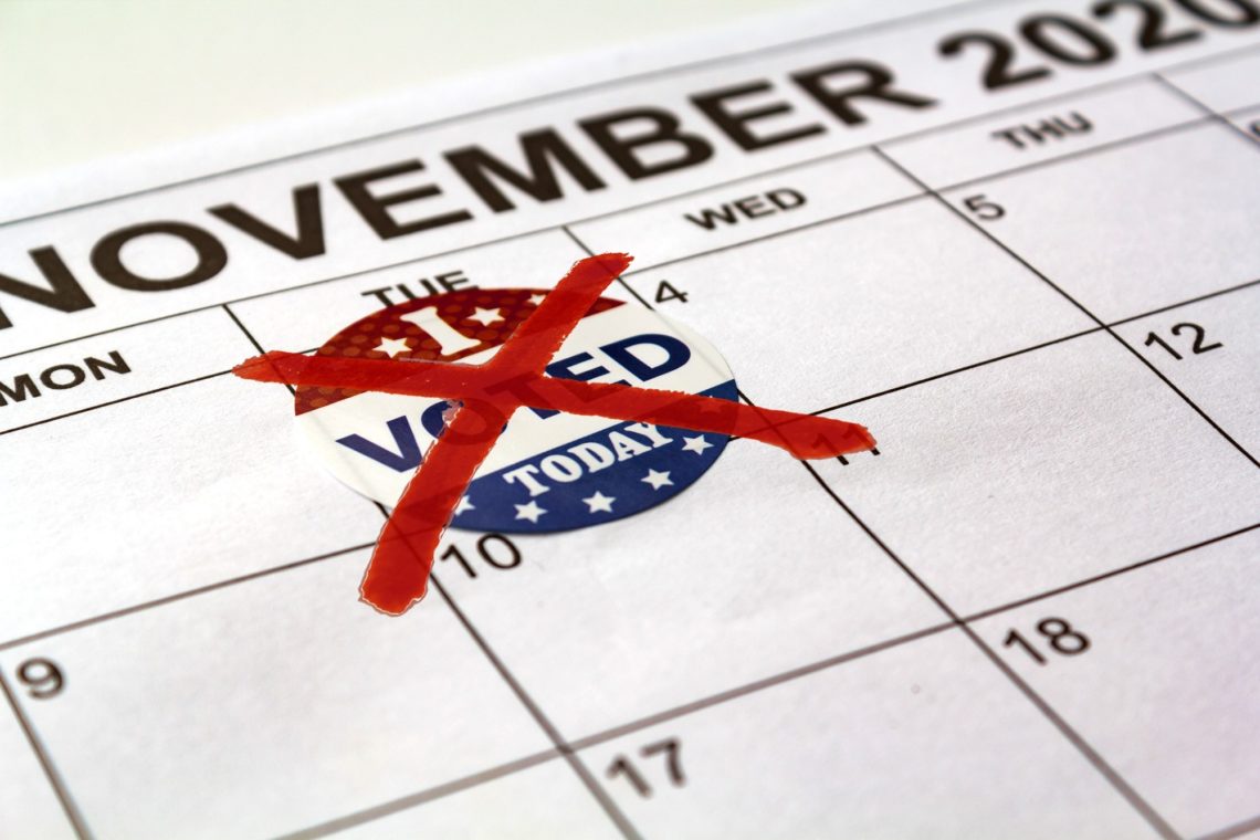 A close-up of a November 2020 calendar with an "I Voted Today" sticker taped to the 3rd with red tape forming an "X" over it, indicating that this day has passed or that the sticker is no longer applicable; a reminder of civic duty emphasized in Berkeley Journalism