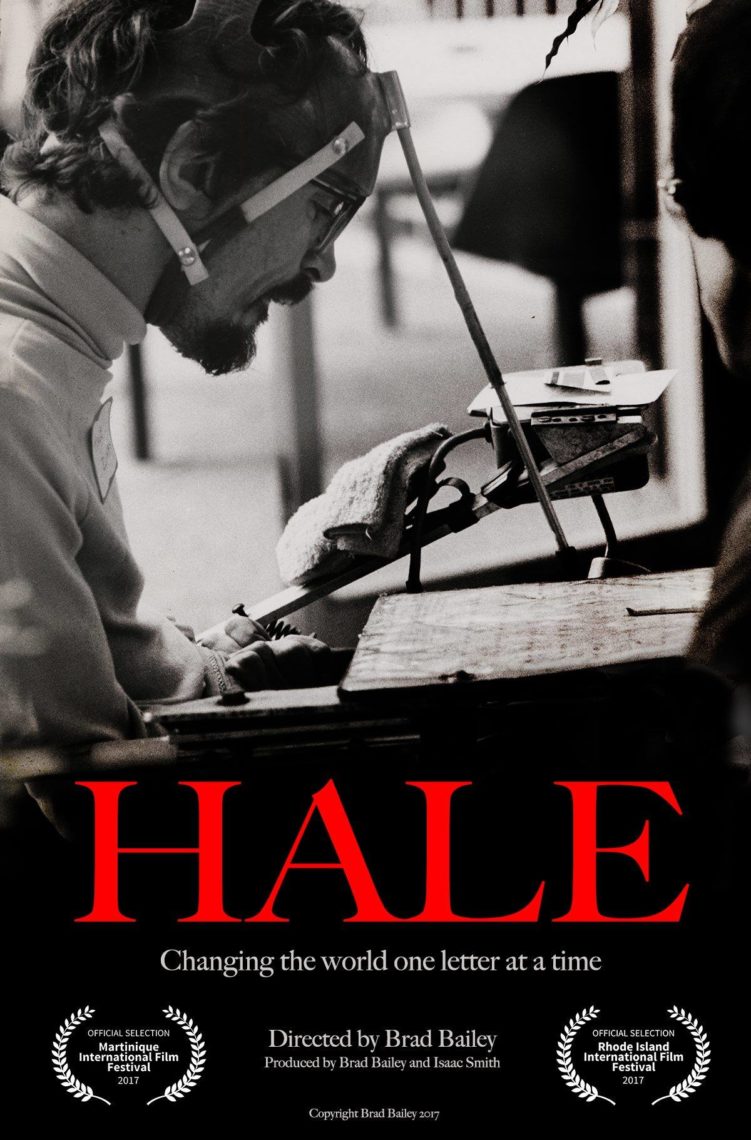 A black and white photo of a man seated in a motorized wheelchair with medical equipment. A poster for a movie named, "Hale: Changing the world one letter at a time". The man is looking down, reading notes.