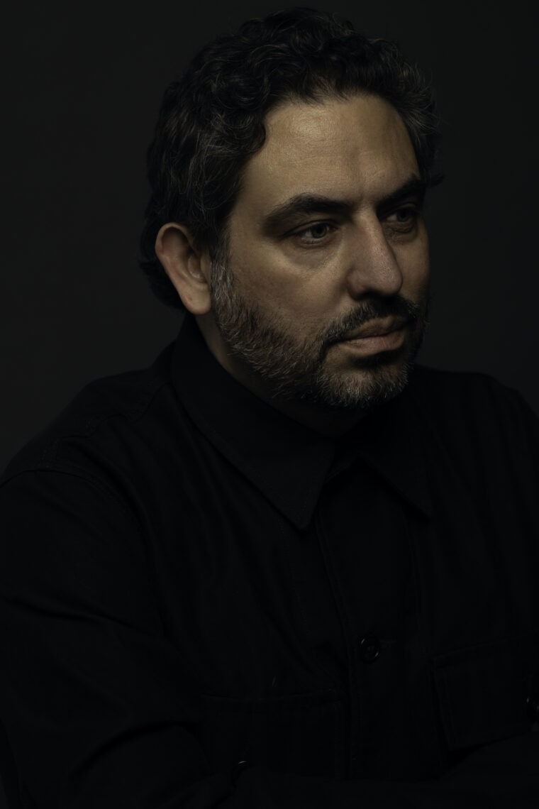 Portrait of filmmaker Bernardo Ruiz wearing a black turtleneck.