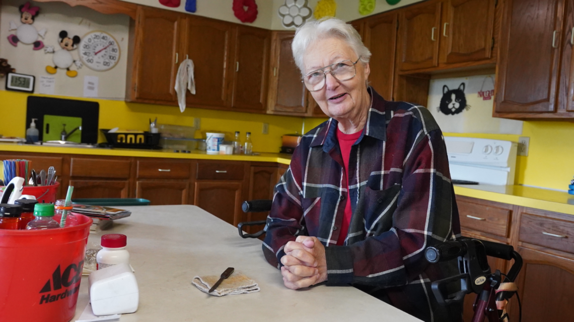 Mary Ellen McConnell sits at her kitchen table. 