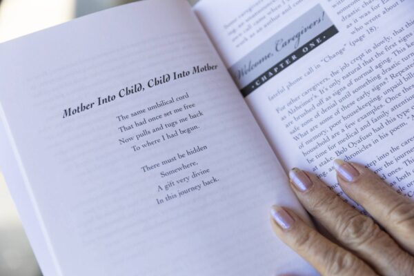The poem “Mother Into Child, Child Into Mother," reads The same umbilical cord
That once had set me free
Now pulls and tugs me back
To where I begun

There must be hidden
Somewhere, 
A gift very divine 
In this journey back. 