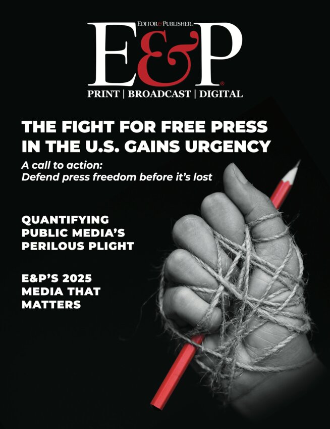 Black white and red cover of E&P with a tied up hand holding a red pencil.