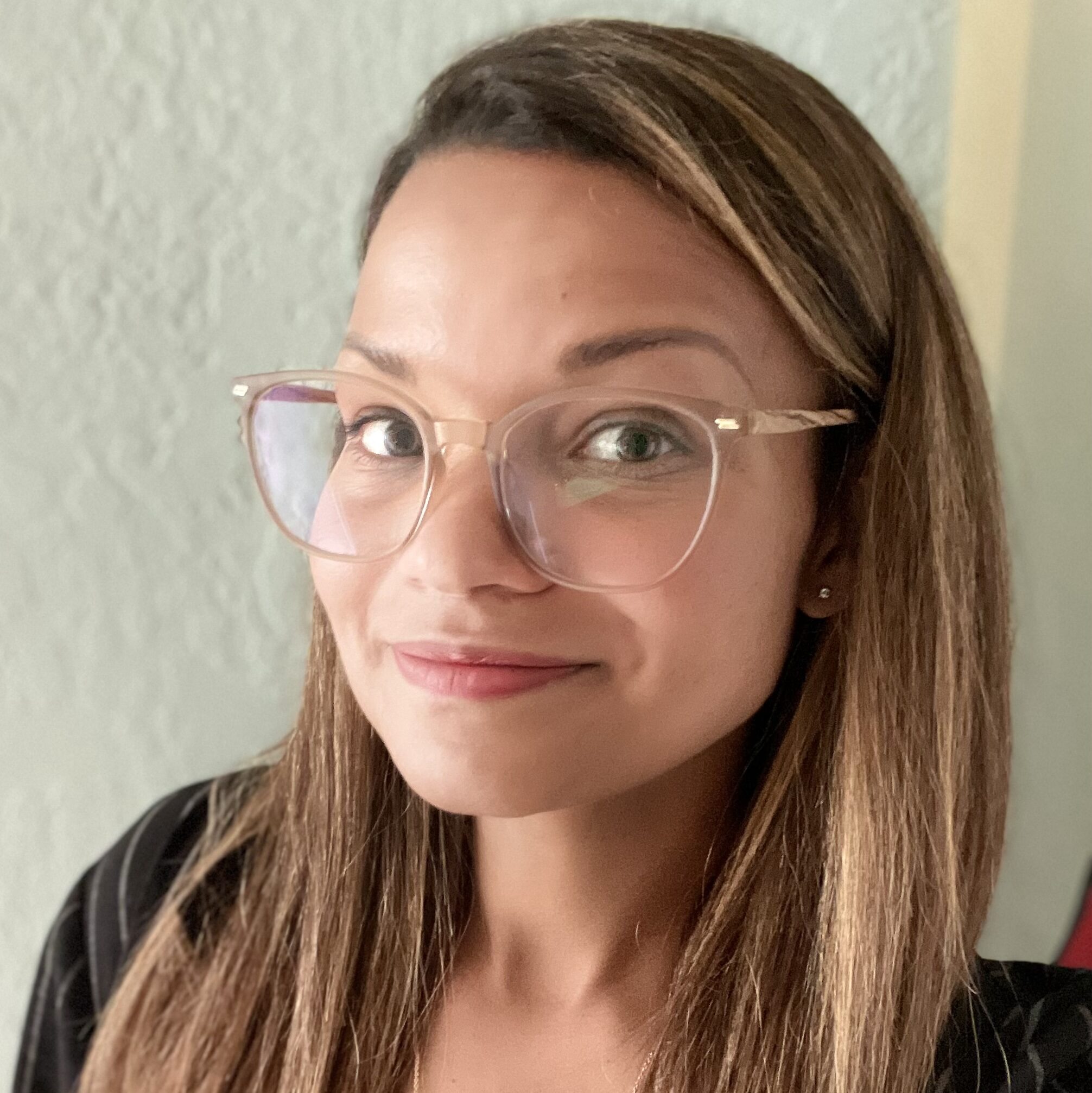 Director of Admissions at Berkeley Journalism, wearing glasses and a smile.