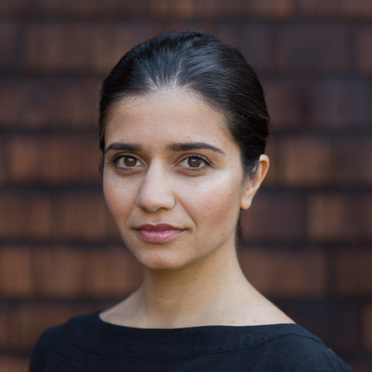Photo by James Tensuan A portrait of a young woman with dark hair and dark eyes.